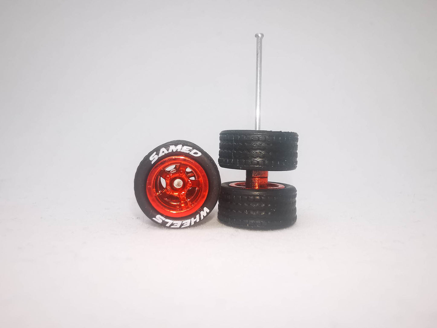 5 bolt 10 mm metallic red ring, black tire with lettering
