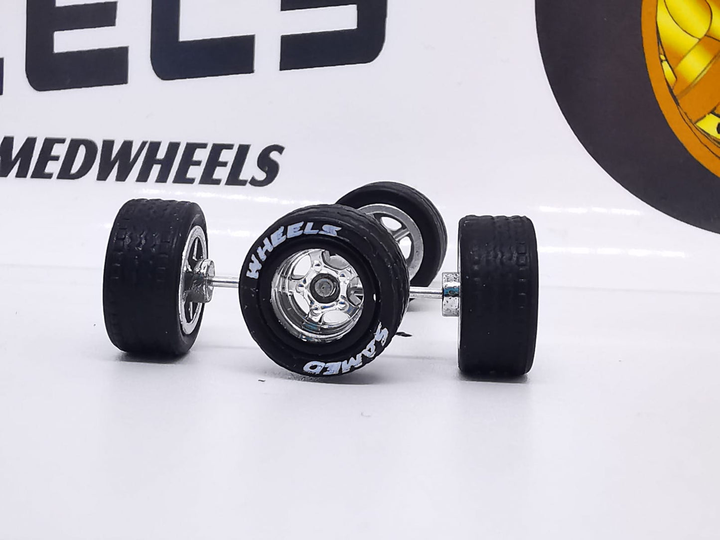 5 bolt 10 mm bronze rim, black tire with letter