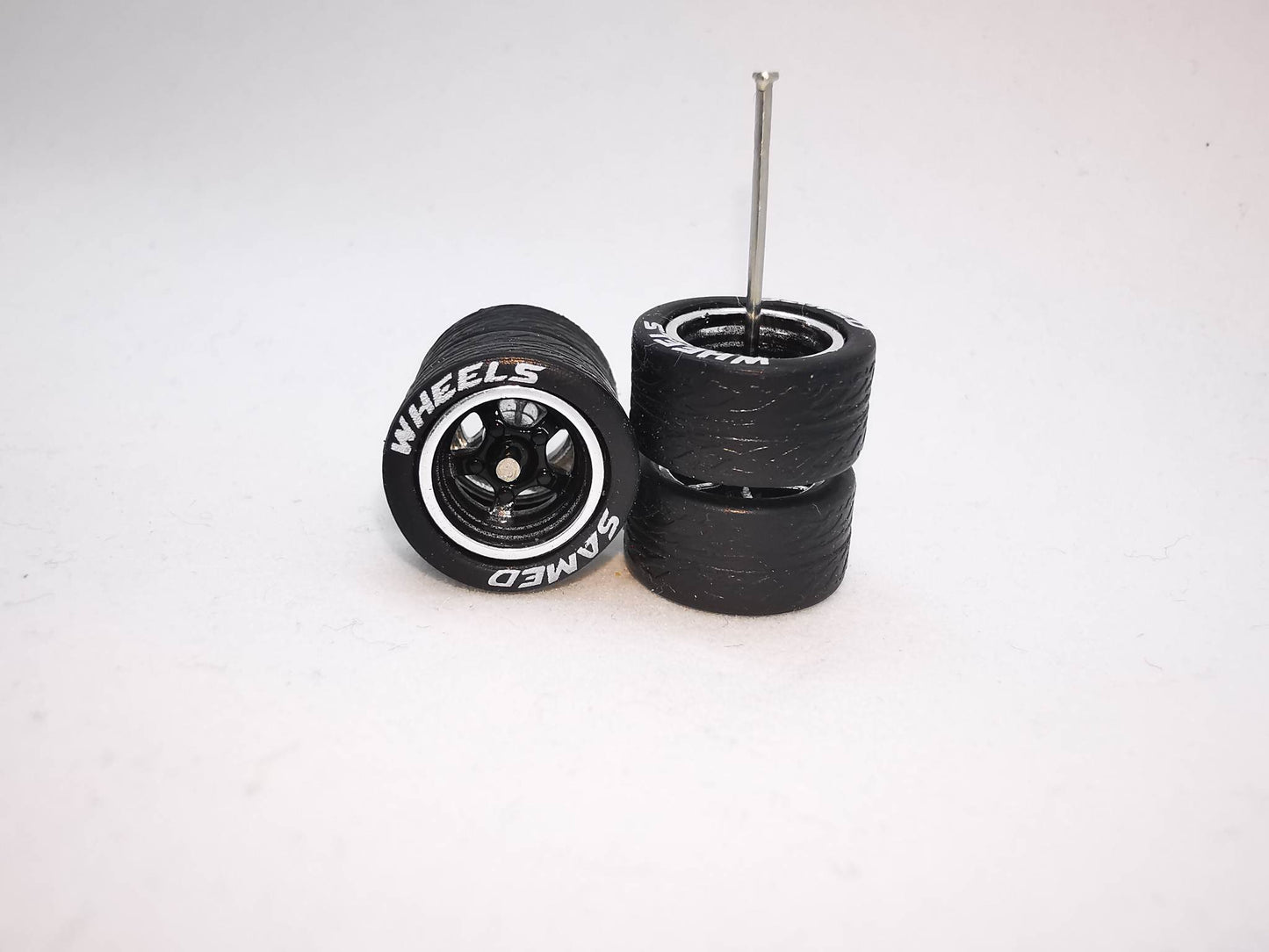 5 bolt 12 mm black chrome ring, black tire with lettering