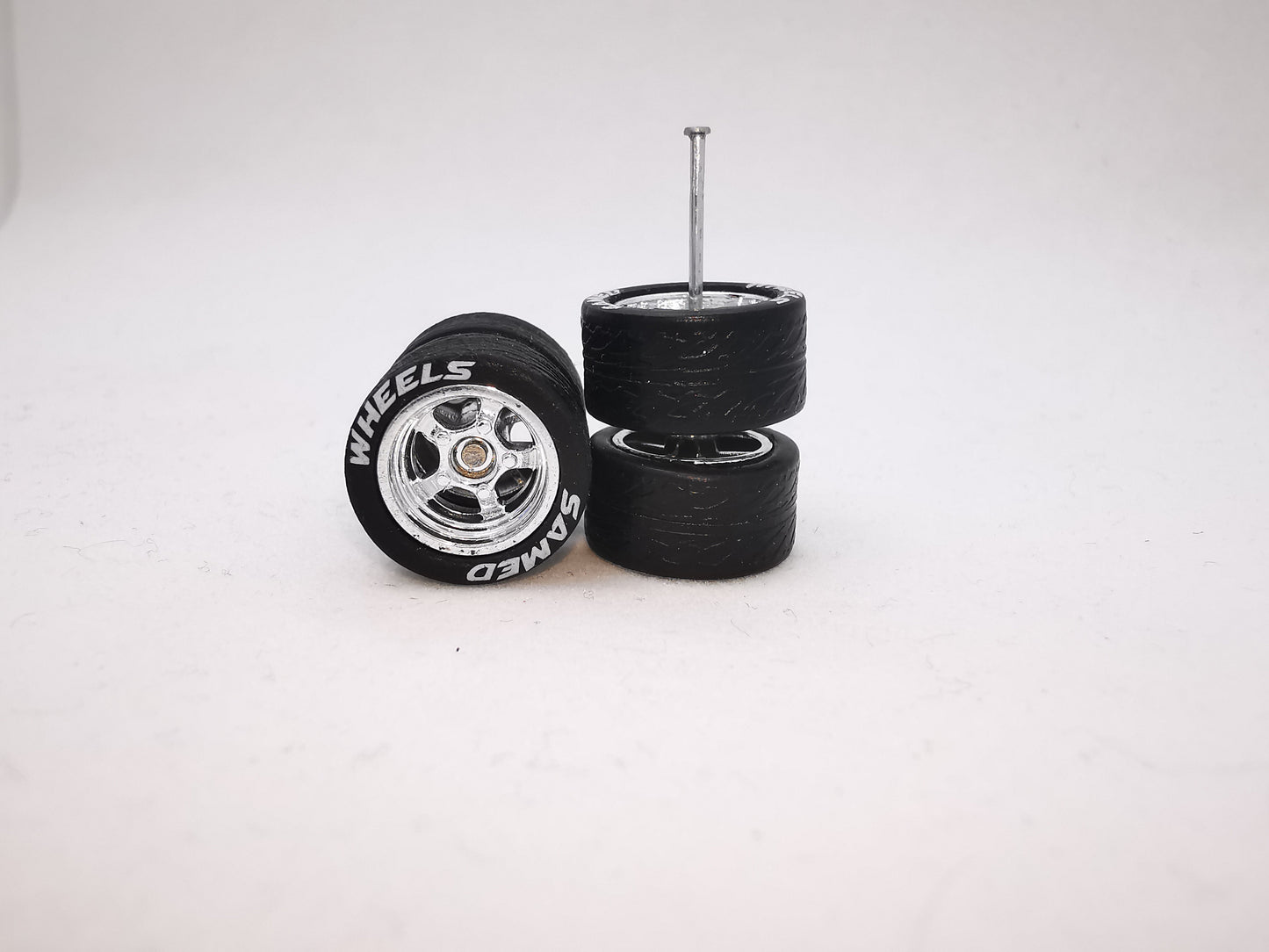 5 bolt 12 mm chrome ring, black tire with lettering