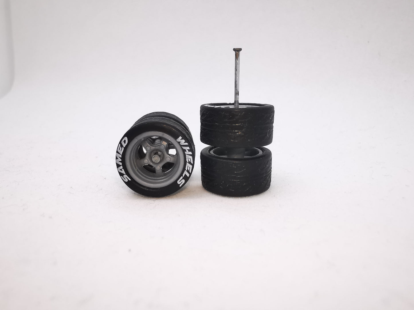 5 bolt 12 mm grey ring, black tire with lettering