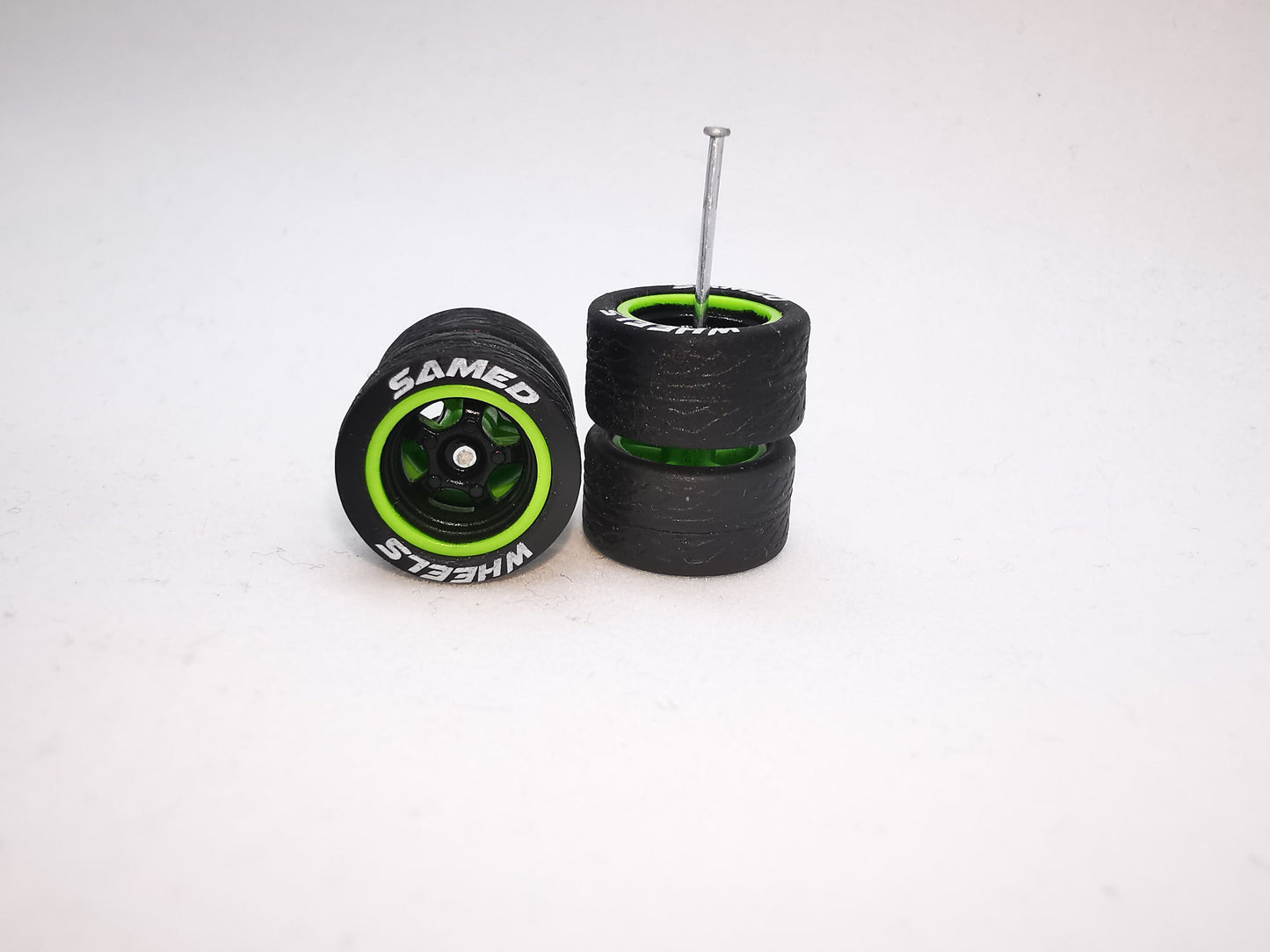 5 bolt 12 mm black green ring, black tire with lettering