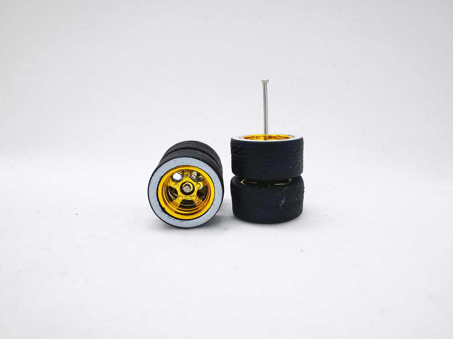 5 bolt 12 mm gold ring, black tire with white wall