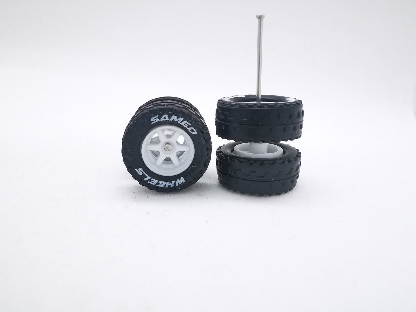 JAGUAR WARRIOR AT 11 MM 6 spoke white ring, black tire with lettering