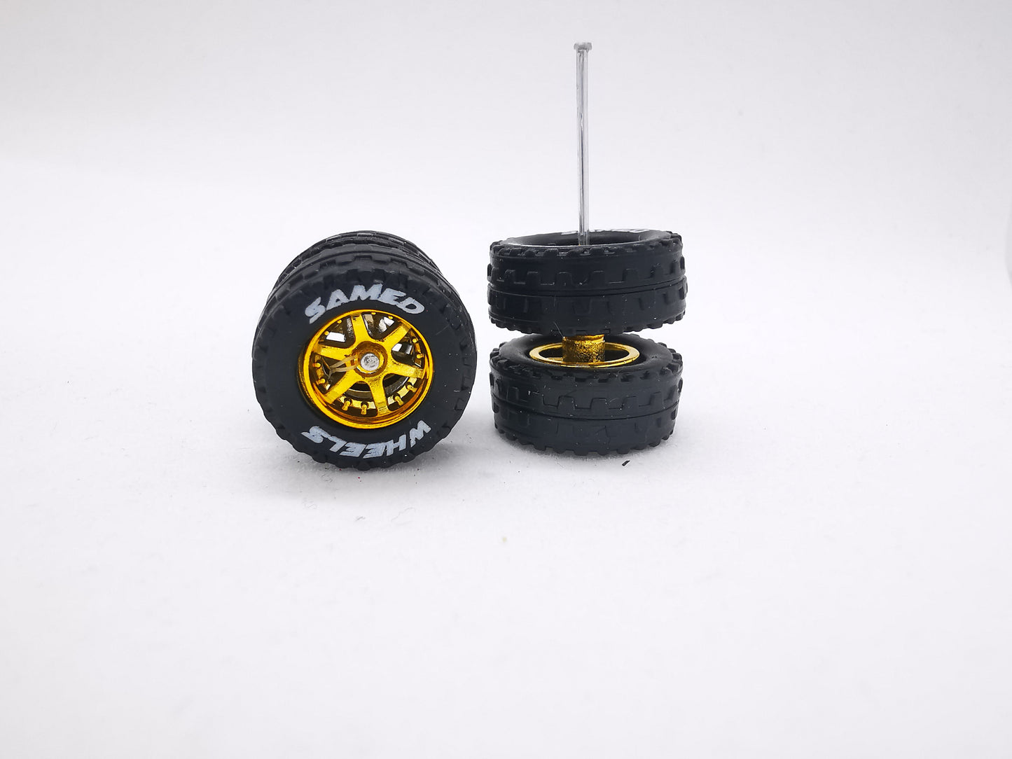 JAGUAR WARRIOR AT 11 MM 6 spoke gold ring, black tire with lettering